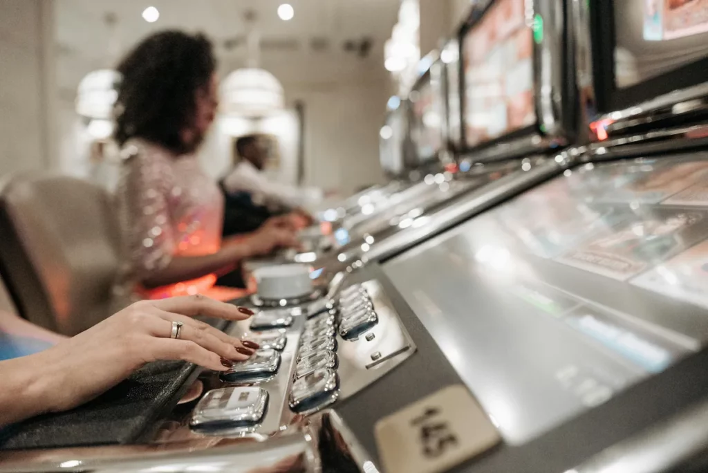 Women playing slot machines in a land-based casino